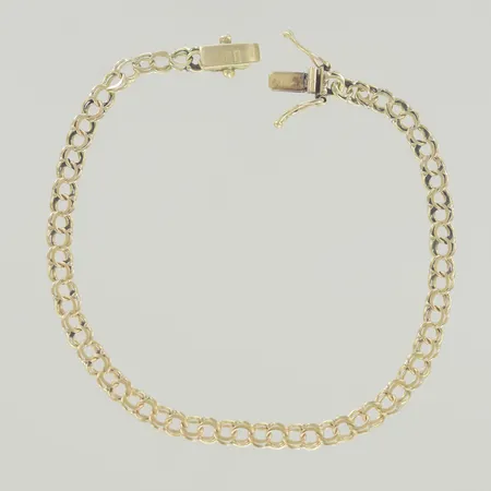 Armband bismark, längd 19, cm bredd 3,8 mm, ojämn länk, 18K Vikt: 4,9 g