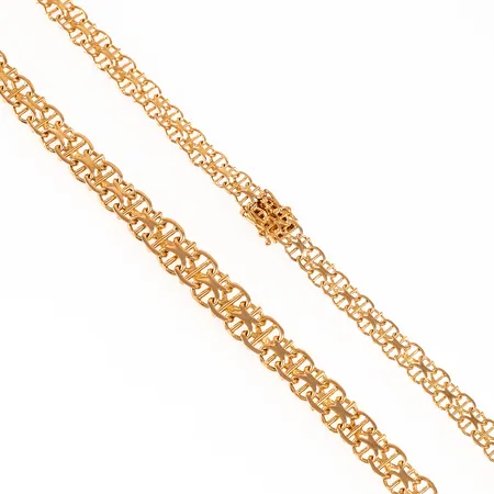 Colliér X-länk med stav i 18K guld. Det är 50 cm långt, 6 - 9 mm brett och väger 29,2g. Fint skick. Kistlås. 