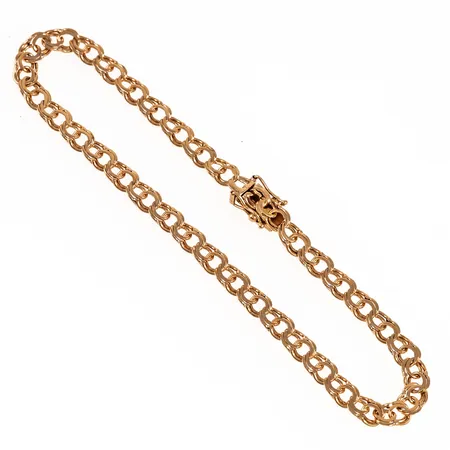 Armband Bismarck i 18K guld. Det är 19,5 cm långt, 4,5 mm brett och väger 5,5g. Kistlås. 