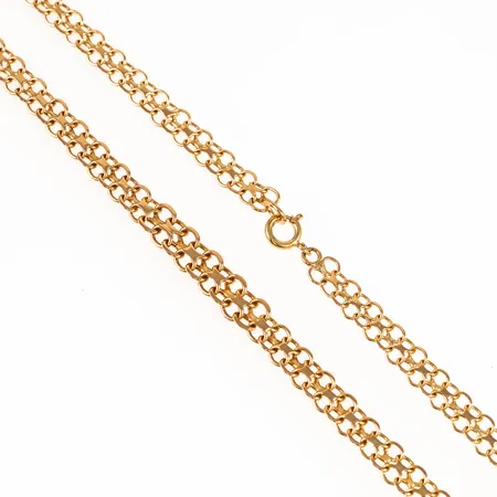Colliér X-länk i 18K guld. Det är 45 cm långt, 5 - 6,5 mm brett och väger 13,4g. Springring. 