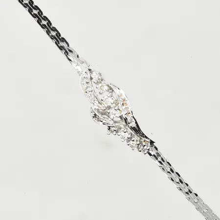 Armband med diamanter ca 0,28ctv, längd 18 cm, bredd 2-9 mm, slapp låsåtta, vitguld, 18K. Vikt: 5,5 g