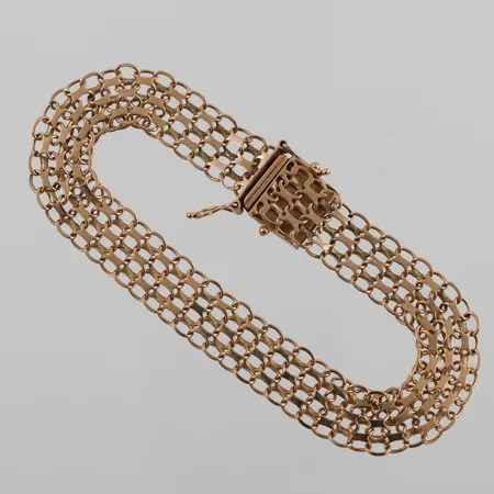Armband 18k X-länk,slitna länkar och lås,längd ca 19 cm,bredd 9.9 mm. Vikt: 11,7 g