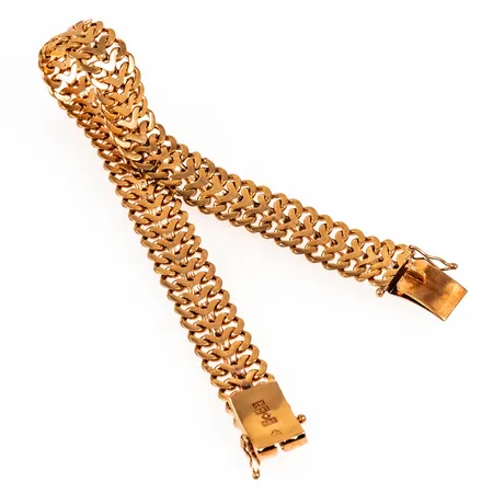 Armband Fiskbenslänk i 18K guld. Det är 61 cm långt, 11 mm brett och väger 33,1g. Kistlås. Bruksskick, ojämnheter. 