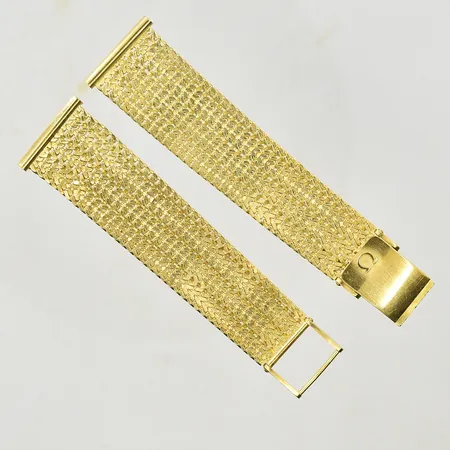 Klocklänk Omega, längd 16-16½ cm, bredd 15-20 mm inklusive integrerade fästen för bandstift, swiss made, 18K. Vikt: 39,3 g