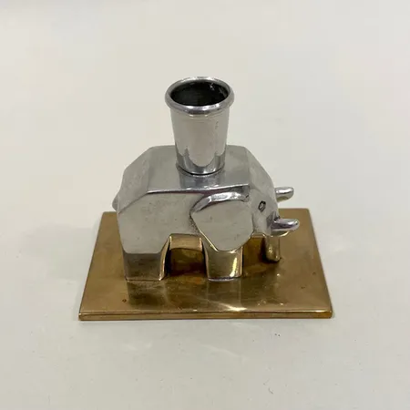 Ljusstake, Firma Svenskt Tenn, formgivare Lidvard Hallset år 1930, höjd: 6cm, tenn, kartong.