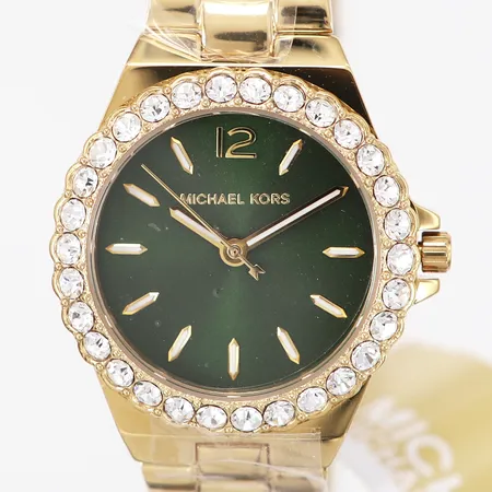 Damur Michael Kors 7395, kvarts, Ø30mm, guldfärgad metall, bezel med vita stenar, grön urtavla, viklås, med box samt etikett, i nyskick.