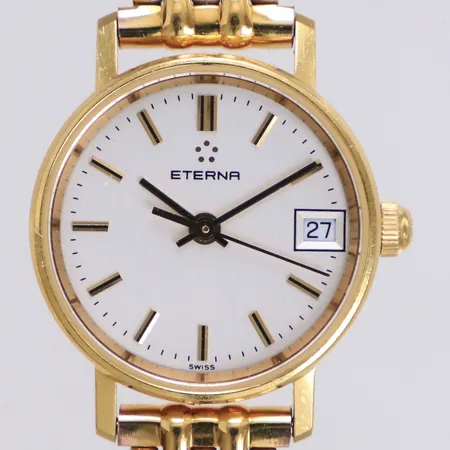 Damur, Eterna, 18K, quartz (går ej), 22mm, boettnr 4700 68, gravyr, länk i guldfärgat stål, länkens längd inklusive ur 18,5cm, inga tillbehör 