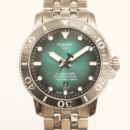 Armbandsur Tissot Seastar 1000, Powermatic 80, Ø43mm, automat, referensnr: T120.407.11.091.01, serienr: CWO96VKE7, stål, datum, stållänk, innermått inklusive ur ca 16cm, 3 extra länkbitar, certifikat från Finland, manual, originalbox, repig, sliten boett och länk