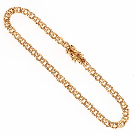 Armband Bismarck i 18K guld. Det är 18,5 cm långt, 3,5 mm brett och väger 5,1g. Kistlås. Stämplad 18K och kattfot. 
