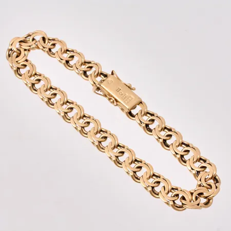 Armband i 18K guld, 20,4cm, Bismarck, bredd 8,3mm, tillverkad av Haldor Vidar Fors, år 1964, vikt 25,17g.