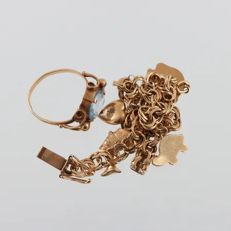 Trasigt guld 18k,någon sten. Vikt: 18,8 g