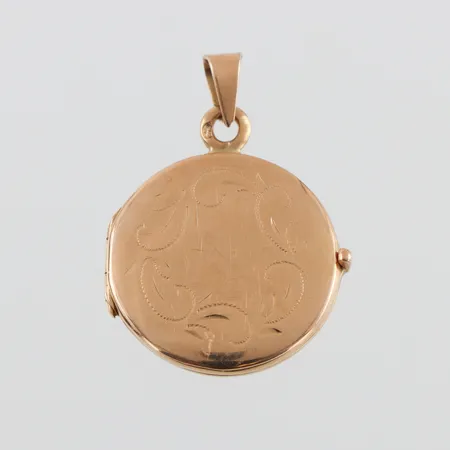 Fotomedaljong 18k,diameter ca 20.2 mm. Vikt: 4,4 g