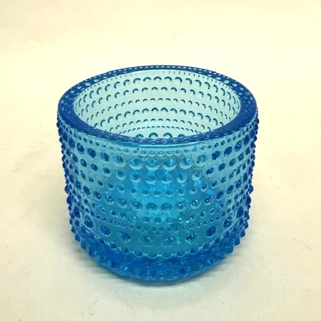 Ljuslykta, höjd 65mm, Ø7,5cm, Kastehelmi, design Oiva Toikka, Iittala, ljusblått glas, originalkartong Vikt: 0 g Skickas med paket.