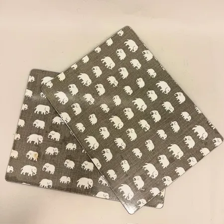 2 bordstabletter, kork, Elefant, beige, design Estrid Ericson, Svenskt Tenn, mått 30x40cm, fläckar, kraftigt slitage Skickas med paket.
