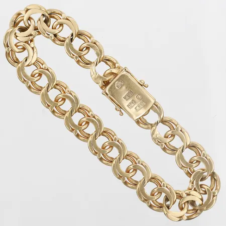 Armband Bismarck, längd: 19cm, bredd: 10mm, Kranig Bruno 	 Bromma år 1964, kistlås, 18K guld.  Vikt: 33,2 g