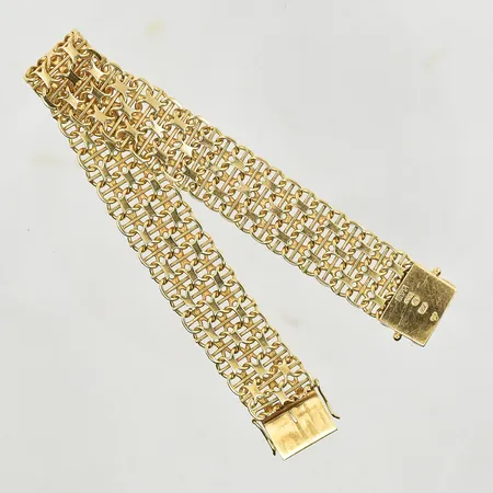 Armband X-länk med stav, längd 19½ cm, bredd 15 mm, 18K. Vikt: 30,5 g