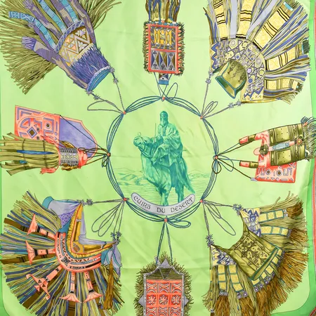 Scarf Hermès, "Cuirs de desert" design Françoise De La Perriere, 1980-tal, med dekor av berberhantverk, ljusgrön botten med mörkare grön bård, ca 90x90 cm, fläckar förekommer, siden. Vikt: 0 g