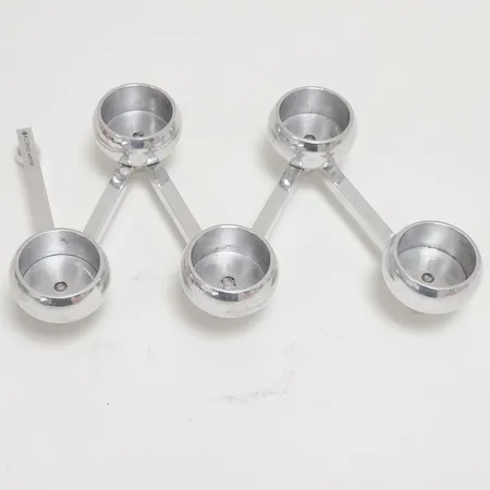 Ljusstake Klong Constella Liten, design av Eva Schildt, fem hållare för värmeljus, längd: 64cm utsträckt, vikbar, stearinrester, något lös