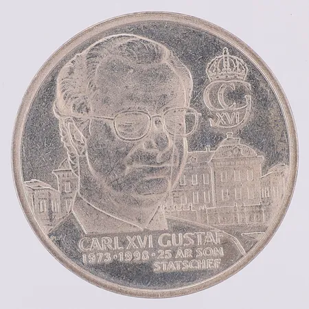 Minnesmynt Carl XVI Gustaf 25 år som statschef, Kungariket Sverige Ø30mm, 925/1000 silver Vikt: 9,4 g