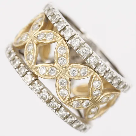 Ring med diamanter total 1,25ctv enligt gravyr, stl: 17¼, bredd: 13mm, stämplad CMNY, tvåfärgad, 18K guld.  Vikt: 10,7 g