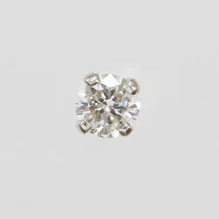 Ett udda örhänge med diamant 1 x ca 0,20ct, W/VS Ø 3,8mm, vitguld, saknar stoppers, 18K Vikt: 0,3 g