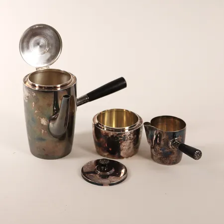 Kaffeservis, tre delar, invändigt med förgyllning, mjölkkanna samt kaffekanna med trähandtag, höjd: 16 - 6cm, GAB, Stockholm år 1945, 830/1000 silver, bruttovikt: 562,7g. 