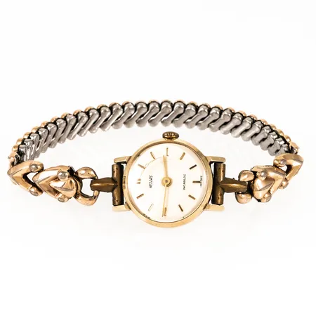 Damur Hellas Incabloc i 14K guld med flexiband i metall. Boett Ø 19,5 mm, manuell, krackelerat/repigt plastglas. Bruttovikt: 15,0g. 