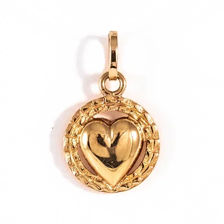 Hänge Hjärta i 18K guld. Det är Ø 11 mm och väger 0,8g. 