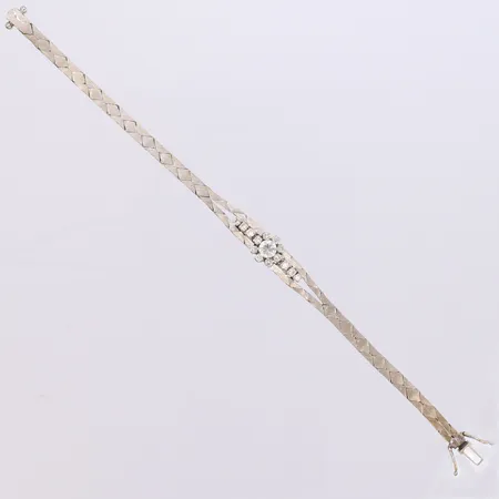 Armband med briljantslipade diamanter ca 0,43ctv samt 1xca 0,52ct, TW(G)/VS enligt gravyr, längd 17,5cm, bredd 8,9mm, vitguld 18K  Vikt: 18,1 g