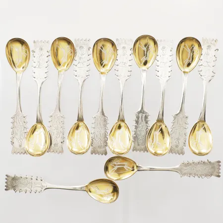 Tolv kaffeskedar med samiskt motiv, längd ca 11,5cm, Persson Aktiebolag C O, Haparanda år 1963, förgyllda blad, 830/1000 silver  Vikt: 165,8 g