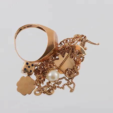 Trasigt guld 18k,någon pärla/sten. Vikt: 10,4 g