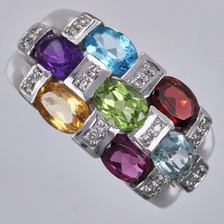 Ring med peridot ametist granat citrin topas och diamanter ca 20x0,005ct stl: 18 bredd: 2-11mm GHA vitguld 18K Vikt: 5,7 g
