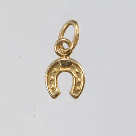 Hänge i form av hästsko 5x10mm inklusive hängöglan GHA 18K  Vikt: 0,2 g