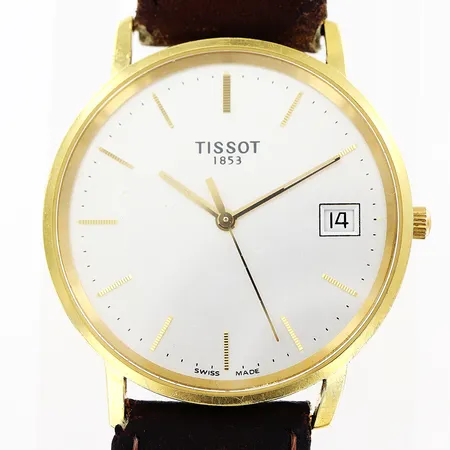 Herrur Tissot 18K, quartz, Ø34mm, vit urtavla, datum, sekundvisare, original brunt läderband 23cm, i behov av batteribyte, inga tillbehör.