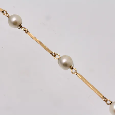 Armband i 18K guld, 19cm, bredd 0,9-5mm, 7st pärlor, mått Ø5mm, bruttovikt 2,72, ca nettovikt 1g.