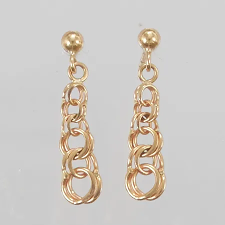 Ett par örhängen Bismarck 23mm, udda snurrebussar 18K 1,8g.