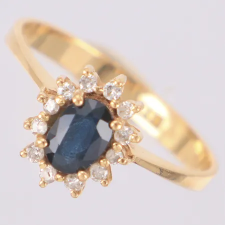 Carmoséring diamanter 12 x ca 0,01ct blå sten troligen safir stl:17½, bredd 10mm, smärre nagg på safir, 18K Vikt: 2,4 g