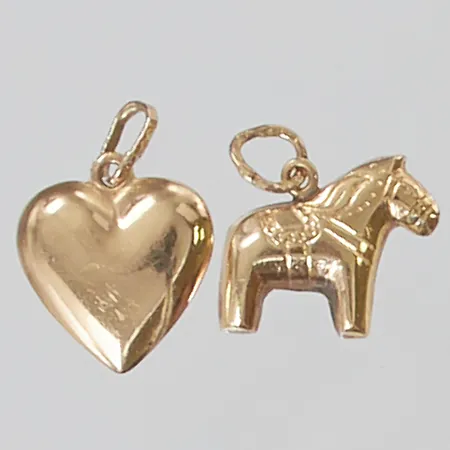 2 Berlocker, klippta öglor, 18K 1,2g.