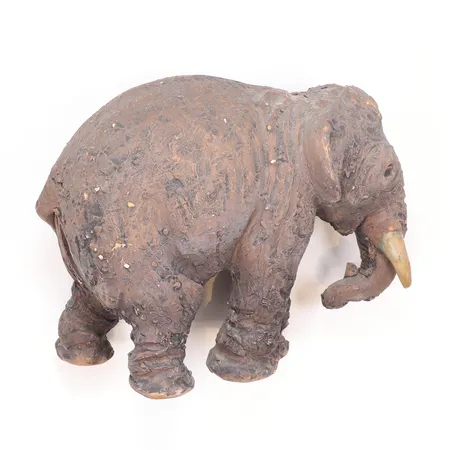 Figurin Tilgmans i form av Elefant i lergods höjd 12cm, med skada på ena beten  Skickas med paket.