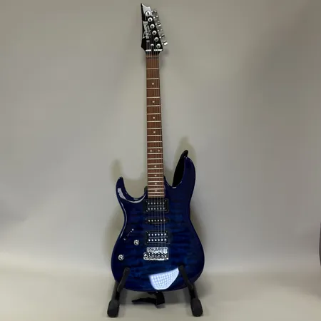 Elgitarr Ibanez GIO GRX70QAL serienr:5Y211201412, tillverkad i kina, vänstervänd, mjukt fodral, blå. Skickas med Bussgods eller PostNord