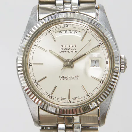 Herrur Sicura Day-Date Full Lever stål automatisk 35,5mm, datum, dag, stållänk, viklås, mycket slitage, färgbortfall, inga tillbehör. 