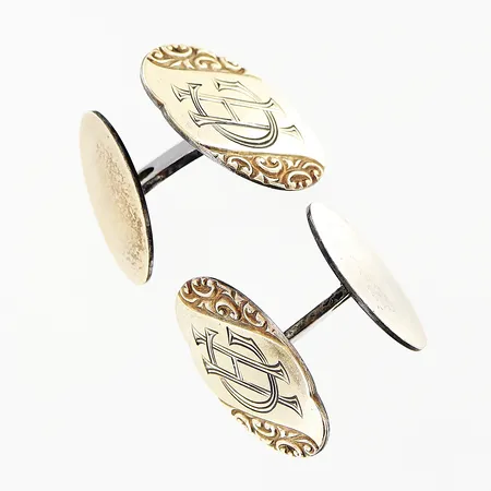 Ett par manschettknappar 20x15mm, monogramgravyr HG, delvis förgyllda, silver 830/1000. Vikt: 7,7 g