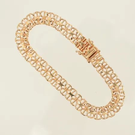 Armband x-länk med stav, längd 18cm, bredd 8mm, stämplad AML, 18K, 12,9g Vikt: 12,9 g