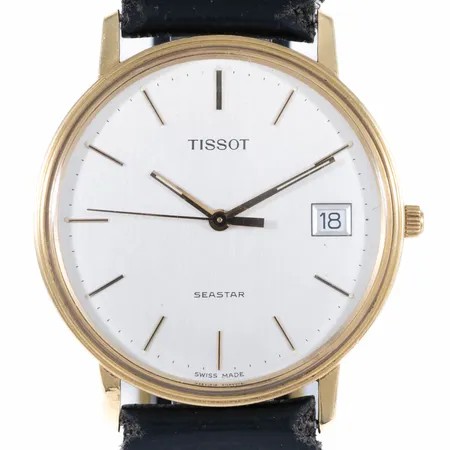 Herrur Tissot Seastar 18K guld quartz 33,5mm, plexiglas, datum, gravyr, fåtal svaga repor, defekt läderband. Går ej - Batteribyte krävs? Vikt: 0 g