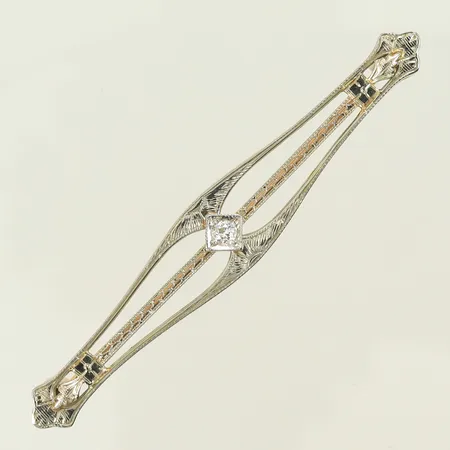 Brosch tvåfärgad med diamant ca 0,10ct, längd 6cm, bredd 6-10mm, 14K, 3,9g Vikt: 3,9 g