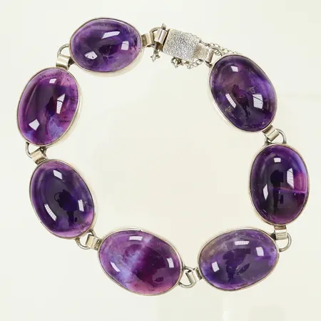 Armband med lila stenar längd ca 19cm, bredd 17mm, Silver 830/1000, 42,3g bruttovikt 