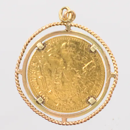 Mynt 1 dukat 98,6 % guld (986/1000). Diameter: 20 mm. Motiv: Framsida: Kejsar Franz Joseph I. Baksida: Österrikiska riksvapnet (dubbelörnen).ram 0,7gr 14k Vikt: 5,2 g