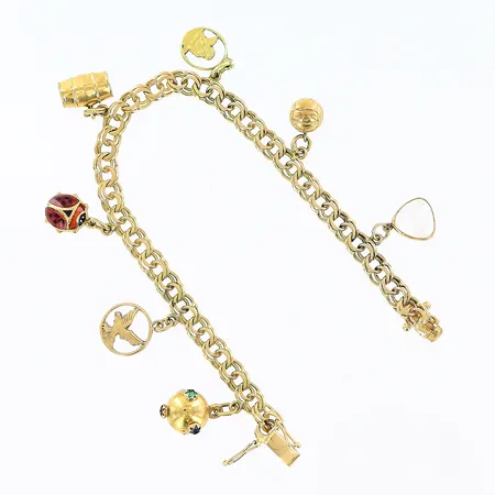 Armband Bismarck 7 berlocker längd 18,5cm bredd 5mm, 1 berlock i 14K, vassa kanter, 18K. Bruttovikt: 17,6gram.  Vikt: 17,6 g