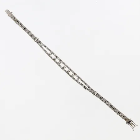Armband vitguld med 7 diamanter, ca 0,02-0,03ct, 18,5cm bredd:4-08mm, defekt länkbit 18K Vikt: 20,4 g