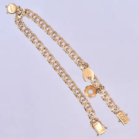 Armband Bismarck med 3 berlocker längd 19 cm, bredd 5 mm 18K. Vikt: 9,9 g